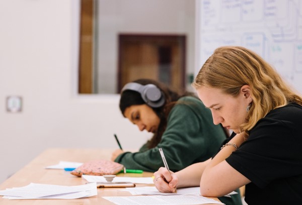 Girl writing in a school book