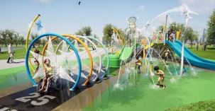 Children playing under water fountains in a park 