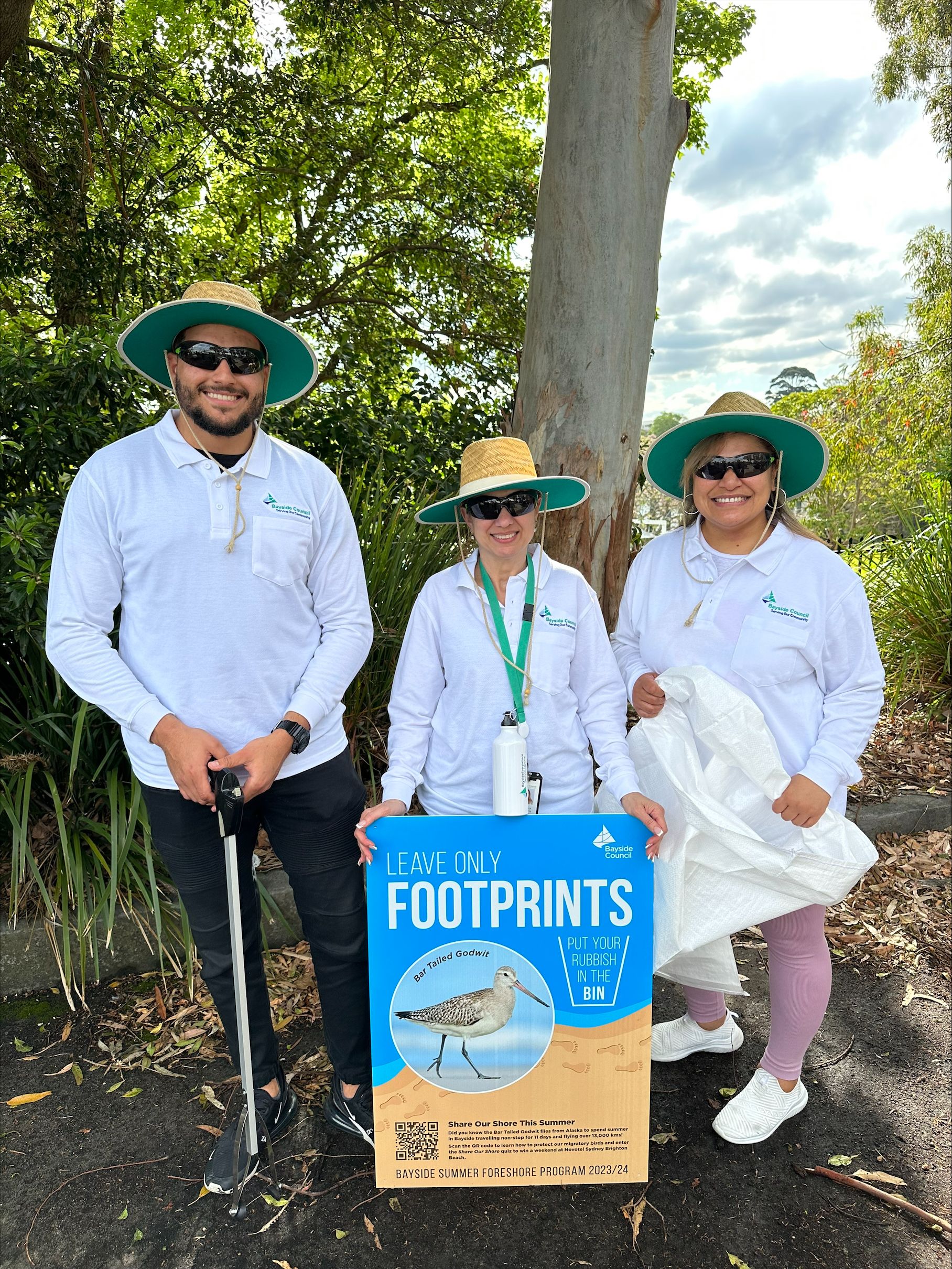 image showing beach buddies with summer foreshore program sign