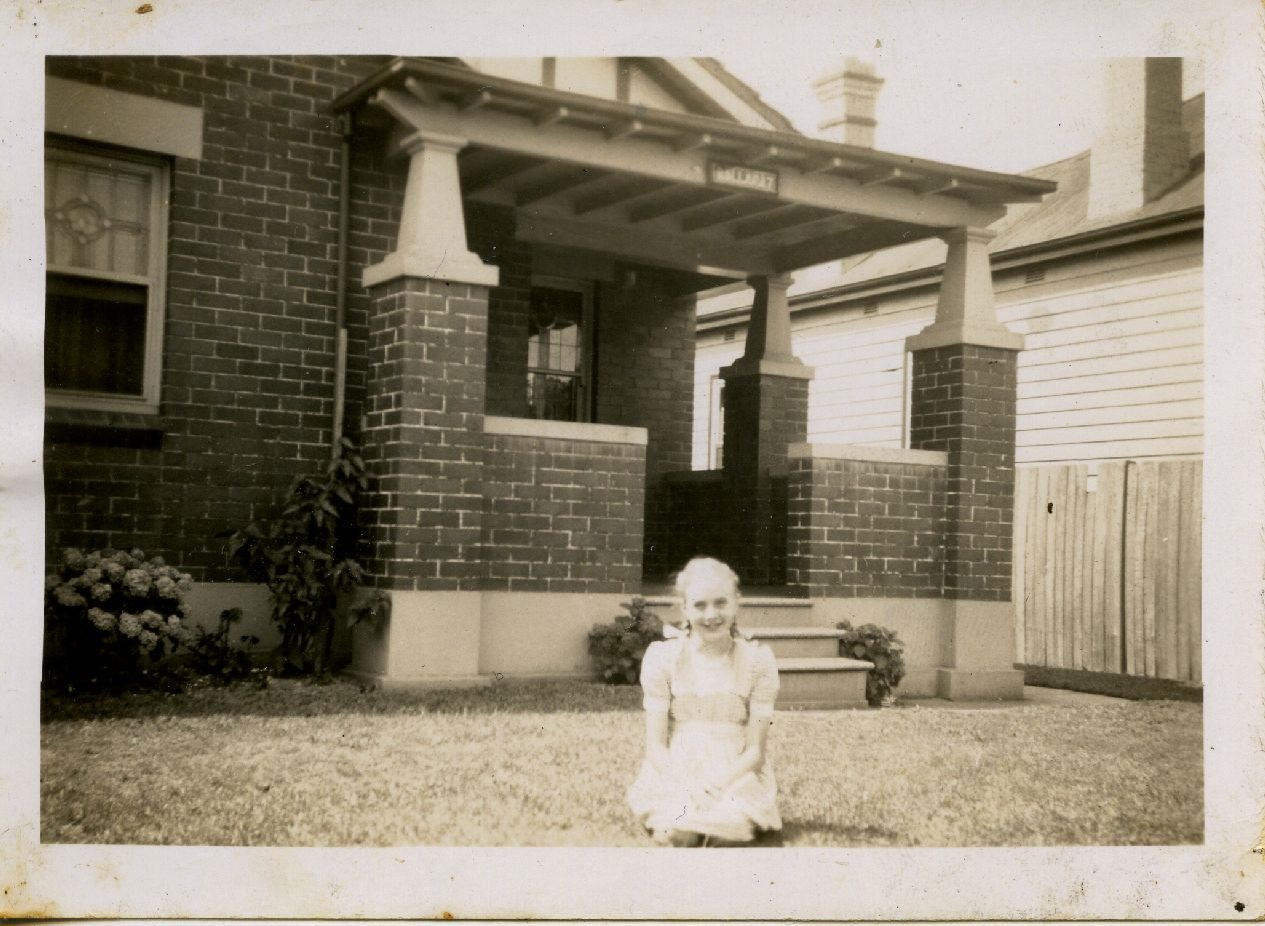 historical photo of charmaine piaud in front of her house