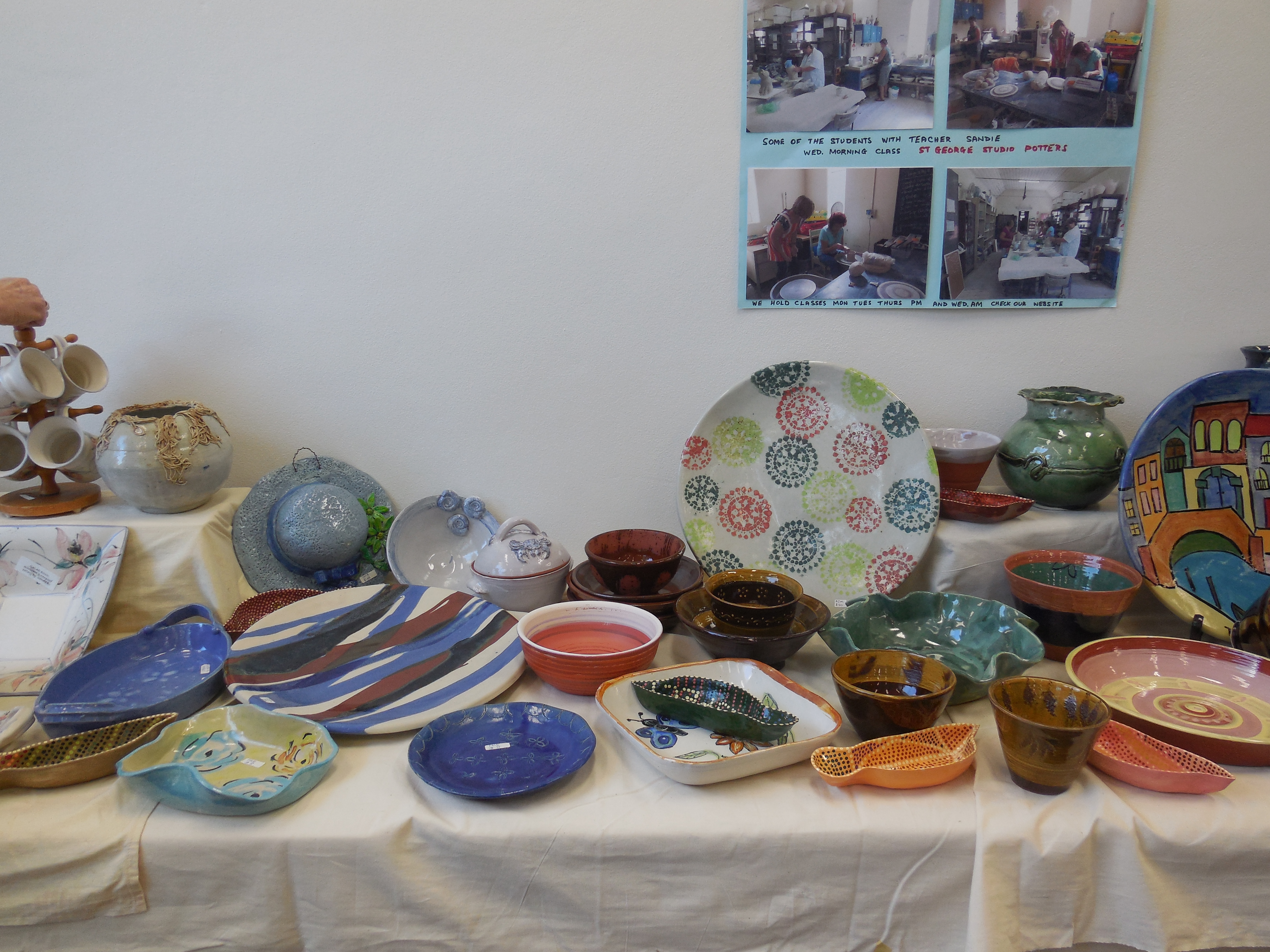 ceramic plates, bowls and assorted goods on display
