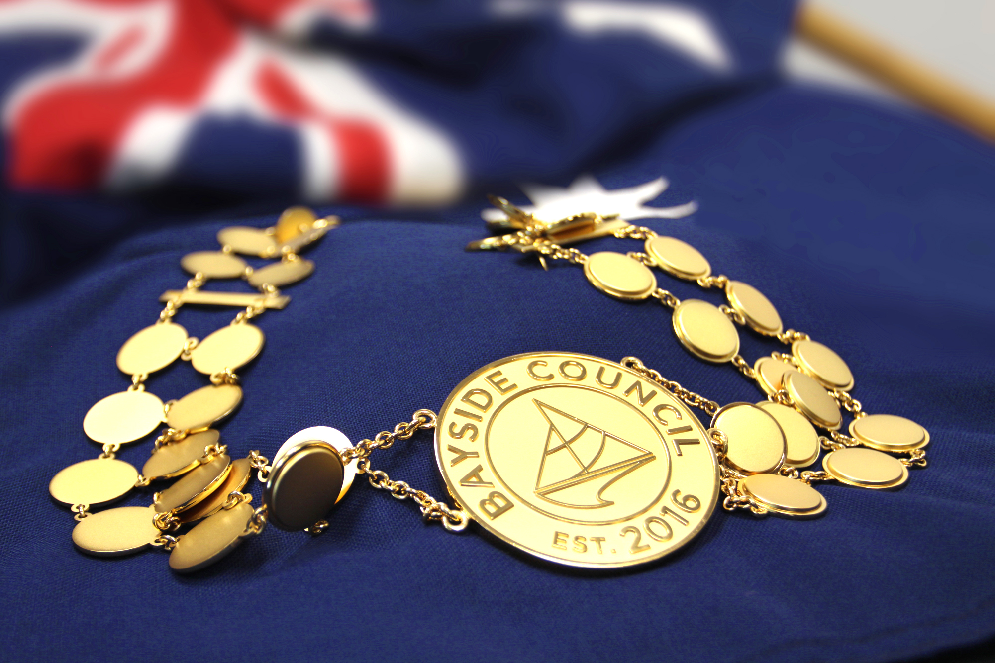 Mayoral gold chain on an Australian Flag 